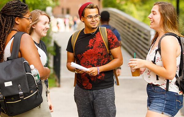 students talking on campus